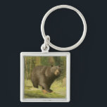 Black Bear Stepping on a Tree Trunk Key Ring<br><div class="desc">This fine art print by Oliver Kemp illustrates a brown bear stepping on a fallen tree in a forest. The pastel green colours are calming for the eye and create a nice warm feeling of the awakening nature in the spring. A great addition to any rustic home decor!</div>