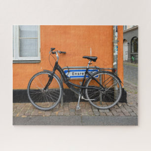 Black Bicycle Against Orange Wall, Aarhus, Denmark Jigsaw Puzzle