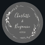 Black Botanical Personalised Script Wedding Names  Classic Round Sticker<br><div class="desc">Dusty Black and White Floral Wreath Monogram Personalised Names and Wedding Date Script Calligraphy Classic Round Sticker</div>