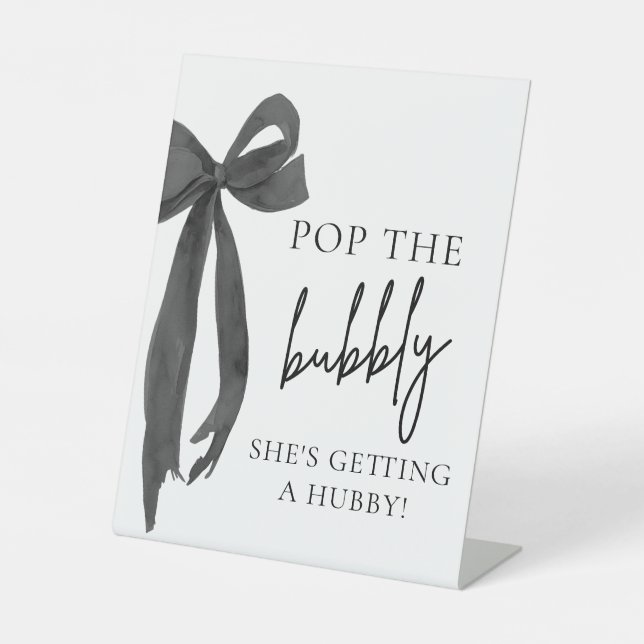 Black Bow Pop The Bubbly She's Getting Hubby Sign (Front)