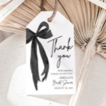Black Bow She's Tying the Knot Bridal Shower Gift Tags<br><div class="desc">The Black Bow She's Tying the Knot Bridal Shower Gift Tags are the perfect finishing touch for your party favours or gifts. Featuring a chic black bow design, these tags add a touch of elegance and sophistication to your bridal shower decor. Personalise them with a heartfelt message or the bride’s...</div>