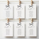 Black Bow Wedding Seating Table Number<br><div class="desc">Elevate your wedding decor with our black and white wedding seating table numbers. Beautifully crafted, these table numbers feature a classic white backdrop adorned with an elegant watercolor black bow. Personalised with your table number, and the names of the guests who are seating at that table. Indulge in sophistication and...</div>