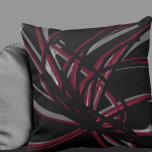 Black & Burgundy Artistic Abstract Ribbons Cushion<br><div class="desc">Black and burgundy throw pillow features an artistic abstract ribbon composition with shades of burgundy and wine with white accents on a black background. This abstract composition is built on combinations of repeated ribbons, which are overlapped and interlaced to form an intricate and complex abstract pattern. The black, burgundy, white...</div>