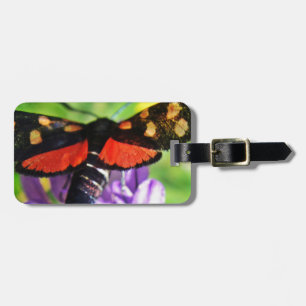 Black butterfly with red wings and red polka dots luggage tag