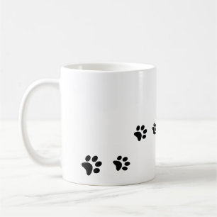 Black cat paw prints on white coffee mug