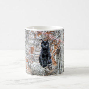 Black Cat Sitting Outdoors Coffee Mug