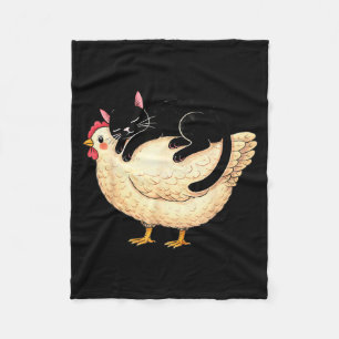 Black cat sleeping on chicken  fleece blanket
