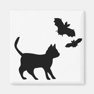 Black cat with bat magnet