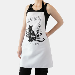 Black cat with flowers and Portuguese expression Apron