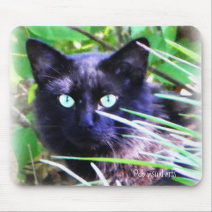 Black cat with striking green eyes mouse mat