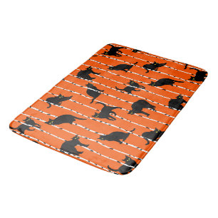 Black Cats and Birch Branches on Vibrant Orange Bath Mat