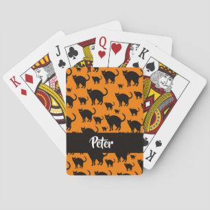 Black cats on orange playing cards