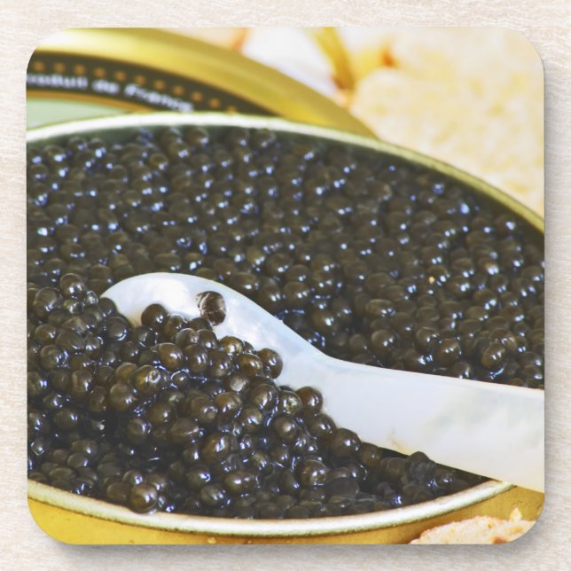 Black caviar and a spoon of mother-of-pearl to coaster (Front)
