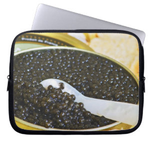 Black caviar and a spoon of mother-of-pearl to laptop sleeve
