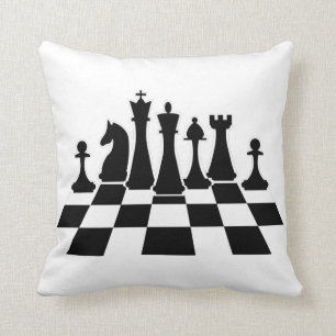 Black chess pieces on a chessboard cushion