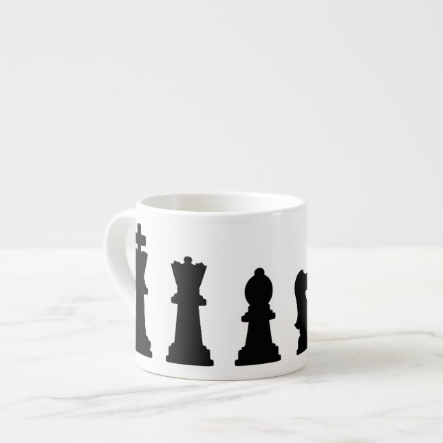 Black chess pieces on white espresso cup (Front Left)