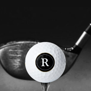 black circle with own initial customised golf balls