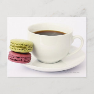 Black coffee in white cup with two french postcard