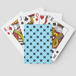 Black cross stitches on baby blue playing cards