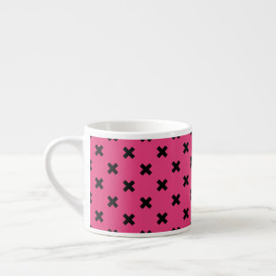 Black cross stitches on fuchsia espresso cup