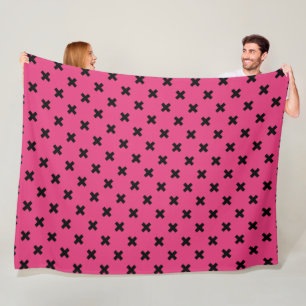 Black cross stitches on fuchsia fleece blanket