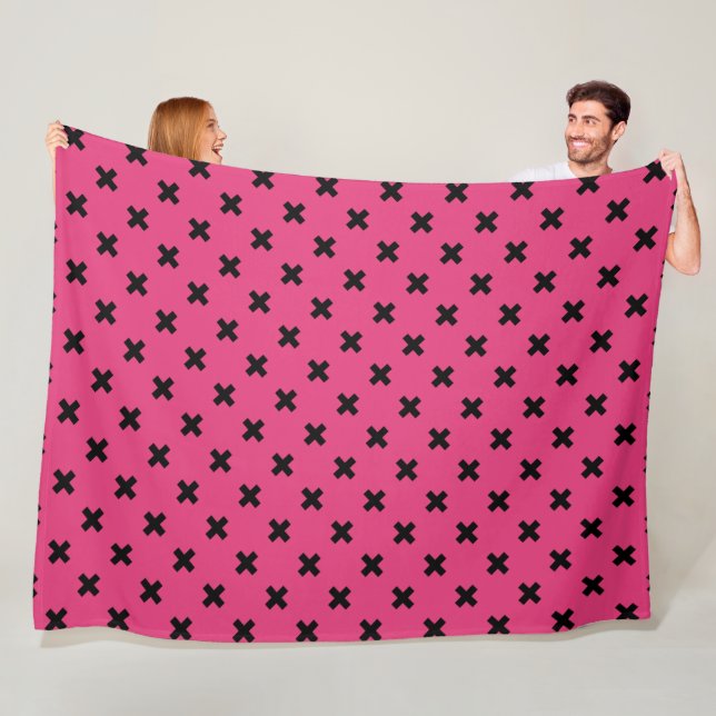 Black cross stitches on fuchsia fleece blanket (In Situ)