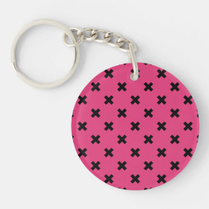 Black cross stitches on fuchsia key ring