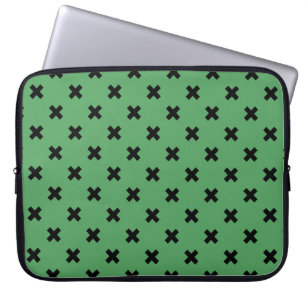Black cross stitches on green laptop sleeve