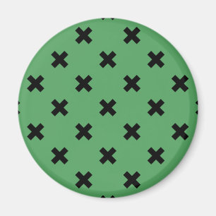 Black cross stitches on green magnet