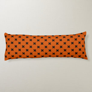 Black cross stitches on orange body cushion