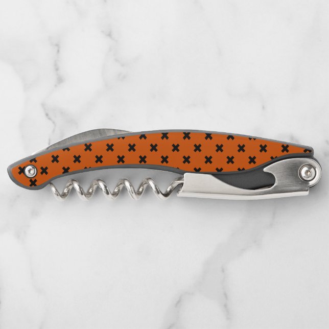Black cross stitches on orange corkscrew (Back)