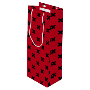 Black cross stitches on red wine gift bag