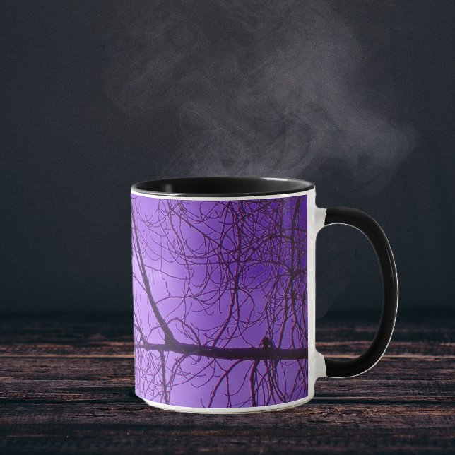Black Crow Purple Sky Mug (Black crow silhouette sitting in black trees with hazy purple sky on coffee or tea mug.)