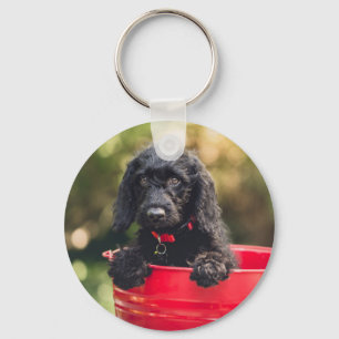 Black Doodle Puppy in a Red Bucket Key Ring