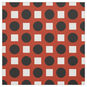 Black dots and white squares on red fabric