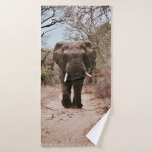 BLACK ELEPHANT WALKING ON BROWN SAND BATH TOWEL