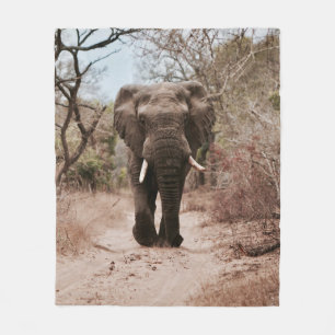 BLACK ELEPHANT WALKING ON BROWN SAND FLEECE BLANKET