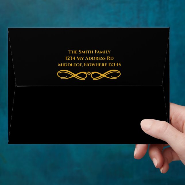 Black envelope with gold interior and address (Hand)