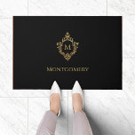 Black Faux Gold Crest Monogram Name Vintage Doormat<br><div class="desc">An elegant black and gold design with the monogram initial in a vintage crest, recommended as a gift for a man. The crest is faux gold foil, the background is black. Under the crest, in small caps, there is the name in golden caps. The vintage floral crest from an old...</div>