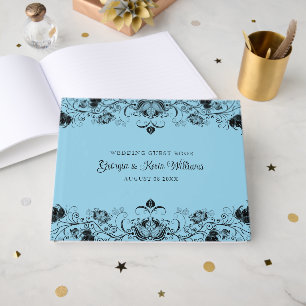 Black floral border on light blue background guest book