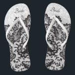 Black Floral Lace and White Glitter Flip Flops<br><div class="desc">Beautiful looking Flip Flop Shoes with faux black floral lace on a faux white glitter background ready for you to personalise with your name or bridal party titles. ⭐This Product is 100% Customisable. *****Click on CUSTOMIZE BUTTON to add, delete, move, resize, changed around, rotate, etc... any of the graphics or...</div>