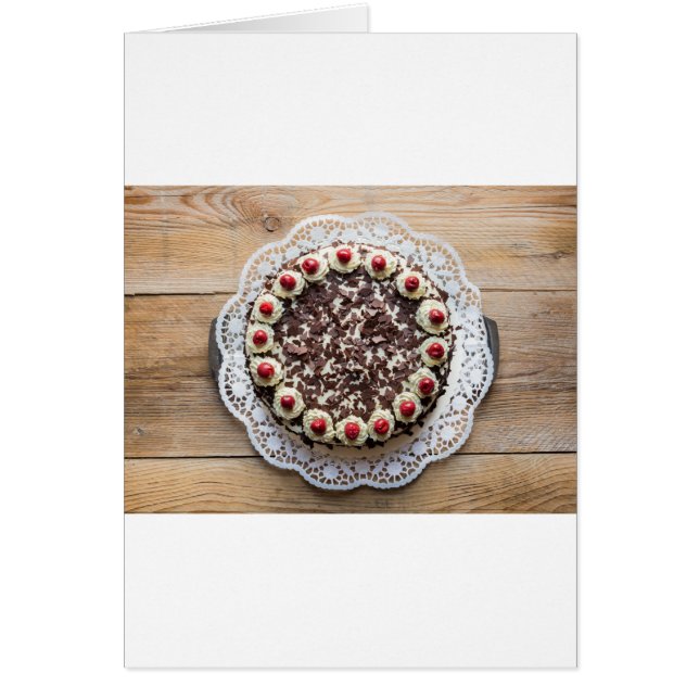 Black Forest cake on rustic wood (Front)