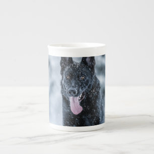 Black German Shepherd in snow Duvet Cover Bone China Mug