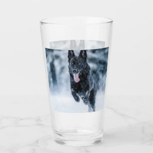 Black German Shepherd in snow Duvet Cover Glass