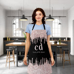 Black glitter drips rose gold monogram business apron<br><div class="desc">A black background decorated with rose gold,  pink sparkling faux glitter drips,  paint dripping look. Personalise and add your monogram initials and name. Modern block letters.</div>