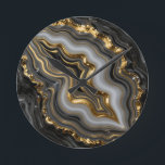 Black Gold Agate Geode Luxury Marble Round Clock<br><div class="desc">Mesmerising black and charcoal agate with flowing bands of soft grey and creamy white,  dramatically framed and veined in molten liquid gold. This opulent,  high-contrast geode design exudes modern luxury,  sophistication and powerful elegance perfect for those who love dark,  glamourous mineral aesthetics.</div>