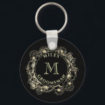 Black Gold Groomsman Monogram Keychain<br><div class="desc">This custom keychain makes a classy and personal groomsman gift,  featuring a gold floral crest with your monogram on a sleek black background. A small but thoughtful keepsake they’ll carry with pride.
Need help adjusting names or initials? Reach me anytime at bpkolman@gmail.com</div>
