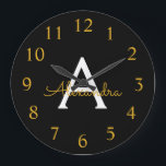Black Gold Modern Script Girly Monogram Name Large Clock<br><div class="desc">Black and Gold Simple Script Monogram Name Clock. This makes the perfect sweet 16 birthday,  wedding,  bridal shower,  anniversary,  baby shower or bachelorette party gift for someone that loves glam luxury and chic styles.</div>