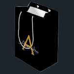 Black Gold Modern Script Girly Monogram Name Medium Gift Bag<br><div class="desc">Black and Gold Simple Script Monogram Name Gift Bag. This makes the perfect sweet 16 birthday,  wedding,  bridal shower,  anniversary,  baby shower or bachelorette party gift bag for someone that loves glam luxury and chic styles.</div>