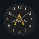 Black Gold Modern Script Girly Monogram Name Round Clock<br><div class="desc">Black and Gold Simple Script Monogram Name Clock. This makes the perfect sweet 16 birthday,  wedding,  bridal shower,  anniversary,  baby shower or bachelorette party gift for someone that loves glam luxury and chic styles.</div>